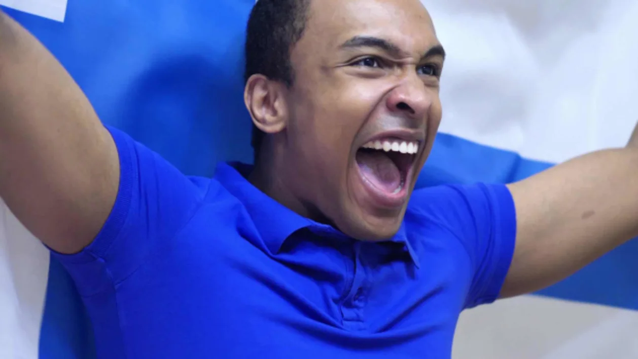 Happy Finnish male with flag